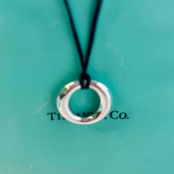 Tiffany & Co. Elsa Peretti Sevillana pre-own silver pendant with silk black cord